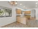 Kitchen features light wood cabinetry, tile flooring, and views to the outside at 39016 N Habitat Cir, Cave Creek, AZ 85331