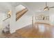 Inviting living area featuring hardwood floors, a staircase, and abundant natural light at 39016 N Habitat Cir, Cave Creek, AZ 85331