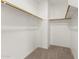 Spacious walk-in closet with carpet flooring and wooden shelving at 39016 N Habitat Cir, Cave Creek, AZ 85331