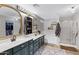 This bathroom has double sinks, stylish mirrors, and a separate shower and tub at 4030 E Meadow Creek Way, San Tan Valley, AZ 85140