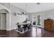 Cozy dining area with modern table, chairs, and convenient access to the backyard at 4030 E Meadow Creek Way, San Tan Valley, AZ 85140