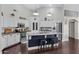 Bright open kitchen with stainless steel appliances, white cabinets, and a large central island at 4030 E Meadow Creek Way, San Tan Valley, AZ 85140
