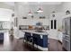 Stylish kitchen with white cabinetry, a central island with seating, and vaulted ceilings at 4030 E Meadow Creek Way, San Tan Valley, AZ 85140