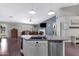 Open-concept kitchen overlooking the living area, featuring stainless steel appliances and ample counter space at 4030 E Meadow Creek Way, San Tan Valley, AZ 85140