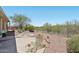 Charming backyard featuring desert landscaping and a cozy patio area, perfect for outdoor relaxation at 41602 N Congressional Dr, Phoenix, AZ 85086