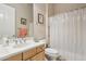 Well-lit bathroom with a vanity, mirror, and shower-tub combo at 41602 N Congressional Dr, Phoenix, AZ 85086