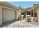 Entrance to home features stone accents and desert landscaping at 41602 N Congressional Dr, Phoenix, AZ 85086