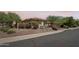 Well-maintained desert home with beautiful landscaping, rock accents, and attractive curb appeal at 41602 N Congressional Dr, Phoenix, AZ 85086