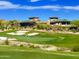 Picturesque golf course with manicured greens, sand traps, and the clubhouse in the background at 41602 N Congressional Dr, Phoenix, AZ 85086