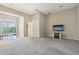 This open-plan living room provides ample space with lots of natural light at 41602 N Congressional Dr, Phoenix, AZ 85086