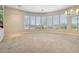 Bright and airy living room featuring a large bay window with views of the surrounding landscape at 41602 N Congressional Dr, Phoenix, AZ 85086