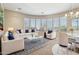 Cozy living room featuring elegant furnishings, a patterned rug, and plenty of natural light at 41602 N Congressional Dr, Phoenix, AZ 85086