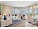 Bright, light filled living room with large curved windows at 41602 N Congressional Dr, Phoenix, AZ 85086