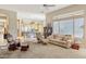 A spacious living room featuring neutral tones, plush carpets, and bright, natural light at 41602 N Congressional Dr, Phoenix, AZ 85086