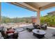 Inviting covered patio with comfortable seating and desert views, perfect for outdoor relaxation and entertaining at 41602 N Congressional Dr, Phoenix, AZ 85086