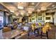 Elegant restaurant and bar area with stylish seating and inviting ambiance for dining at 41602 N Congressional Dr, Phoenix, AZ 85086
