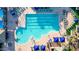 Aerial view of a sparkling swimming pool with lap lanes, lounge chairs, and shaded areas at 41602 N Congressional Dr, Phoenix, AZ 85086