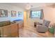 Adorable bedroom with nature-themed decor, a rocking chair and charming crib at 4202 E Sahuaro Dr, Phoenix, AZ 85028
