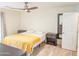 Cozy bedroom with a ceiling fan, neutral decor, and ample natural light at 4202 E Sahuaro Dr, Phoenix, AZ 85028