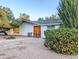 Inviting single-story home with a beautifully landscaped front yard and double door entry at 4202 E Sahuaro Dr, Phoenix, AZ 85028
