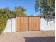 Wooden gate providing access to the back of the property and a side yard at 4202 E Sahuaro Dr, Phoenix, AZ 85028