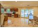Open kitchen with wood cabinets, granite countertops, stainless steel appliances, and large windows at 4202 E Sahuaro Dr, Phoenix, AZ 85028