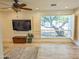 Relaxing living room with a large window and a view of outdoor trees at 4202 E Sahuaro Dr, Phoenix, AZ 85028