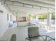 Covered patio with outdoor seating, lighting, and built-in grill at 4202 E Sahuaro Dr, Phoenix, AZ 85028