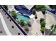 Aerial view of backyard featuring a pool, covered patio, and desert landscaping at 44468 W Eddie Way, Maricopa, AZ 85138