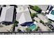 An aerial view of a home, showcasing its backyard pool, patio, and well-manicured landscaping at 44468 W Eddie Way, Maricopa, AZ 85138