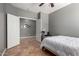 Spare bedroom featuring tile floor, white trim and an open door at 44468 W Eddie Way, Maricopa, AZ 85138