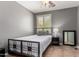 Spare bedroom featuring neutral walls, tile floor and a window at 44468 W Eddie Way, Maricopa, AZ 85138