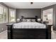 Comfortable main bedroom showcasing a decorative bed frame and neutral decor at 44468 W Eddie Way, Maricopa, AZ 85138