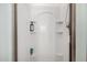 A clean white shower stall with built-in shelves and modern fixtures at 44468 W Eddie Way, Maricopa, AZ 85138