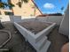Backyard area enclosed with a low block wall and decorative rock at 4636 E Carmen St, Phoenix, AZ 85044