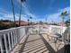The balcony offers a table and chair to enjoy the beautiful surrounding views at 4636 E Carmen St, Phoenix, AZ 85044