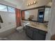 Bright bathroom featuring a large mirror, tub, and modern vanity with light gray cabinets at 4636 E Carmen St, Phoenix, AZ 85044