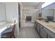 The Bathroom features a shower with gold-framed glass doors and a vanity with gray drawers at 4636 E Carmen St, Phoenix, AZ 85044