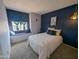 Comfortable bedroom with carpet floors, a window seat and stylish lighting at 4636 E Carmen St, Phoenix, AZ 85044