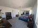 Large bedroom with expansive space, mirrored closet doors, and carpeted flooring at 4636 E Carmen St, Phoenix, AZ 85044