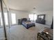 Expansive bedroom with big windows, closet mirror doors, and neutral carpet flooring at 4636 E Carmen St, Phoenix, AZ 85044