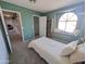 Comfortable bedroom with carpet floors, a window seat with a view and a built-in bookshelf at 4636 E Carmen St, Phoenix, AZ 85044