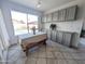 Bright breakfast nook area featuring a large window with a pool view and built-in storage cabinets at 4636 E Carmen St, Phoenix, AZ 85044