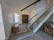 Inviting foyer features tile flooring, a staircase, and a wooden front door at 4636 E Carmen St, Phoenix, AZ 85044