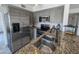 Updated kitchen featuring stainless steel appliances, granite countertops, grey cabinets and tile floors at 4636 E Carmen St, Phoenix, AZ 85044