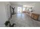 Open living space with tile flooring, backyard patio access, and a breakfast bar looking into the kitchen at 4636 E Carmen St, Phoenix, AZ 85044