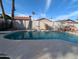 Swimming pool with rock waterfall feature and views of palm trees at 4636 E Carmen St, Phoenix, AZ 85044