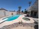 Sparkling backyard pool and spa with a waterfall feature and ample space for recreation at 4636 E Carmen St, Phoenix, AZ 85044