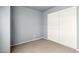 Bedroom featuring a closet with sliding doors and neutral carpet at 5201 N 42Nd N Pkwy, Phoenix, AZ 85019