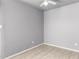 Neutral bedroom features tile floor, ample natural light, and ceiling fan at 5201 N 42Nd N Pkwy, Phoenix, AZ 85019